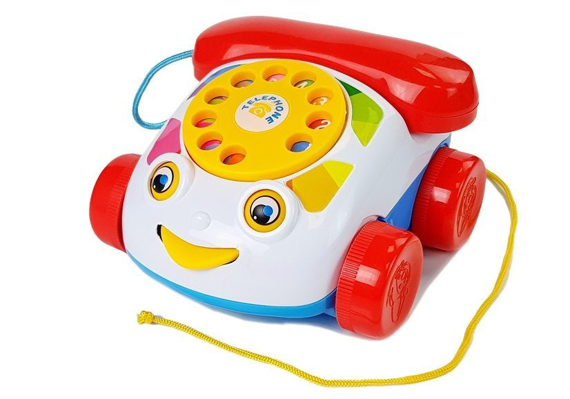 Tempimo telefonas ant ratukų su baterija kūdikiui
