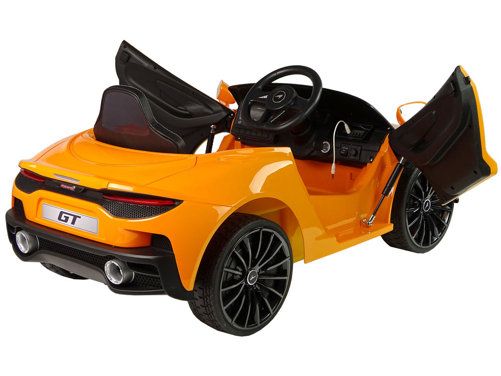 Elektrinis važiuojamas automobilis McLaren GT 12V, oranžinis, lakuotas